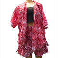 Red and white patterned kimono-style garment on a mannequin against a white background
