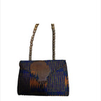 Woven handbag with blue and brown pattern on a white background