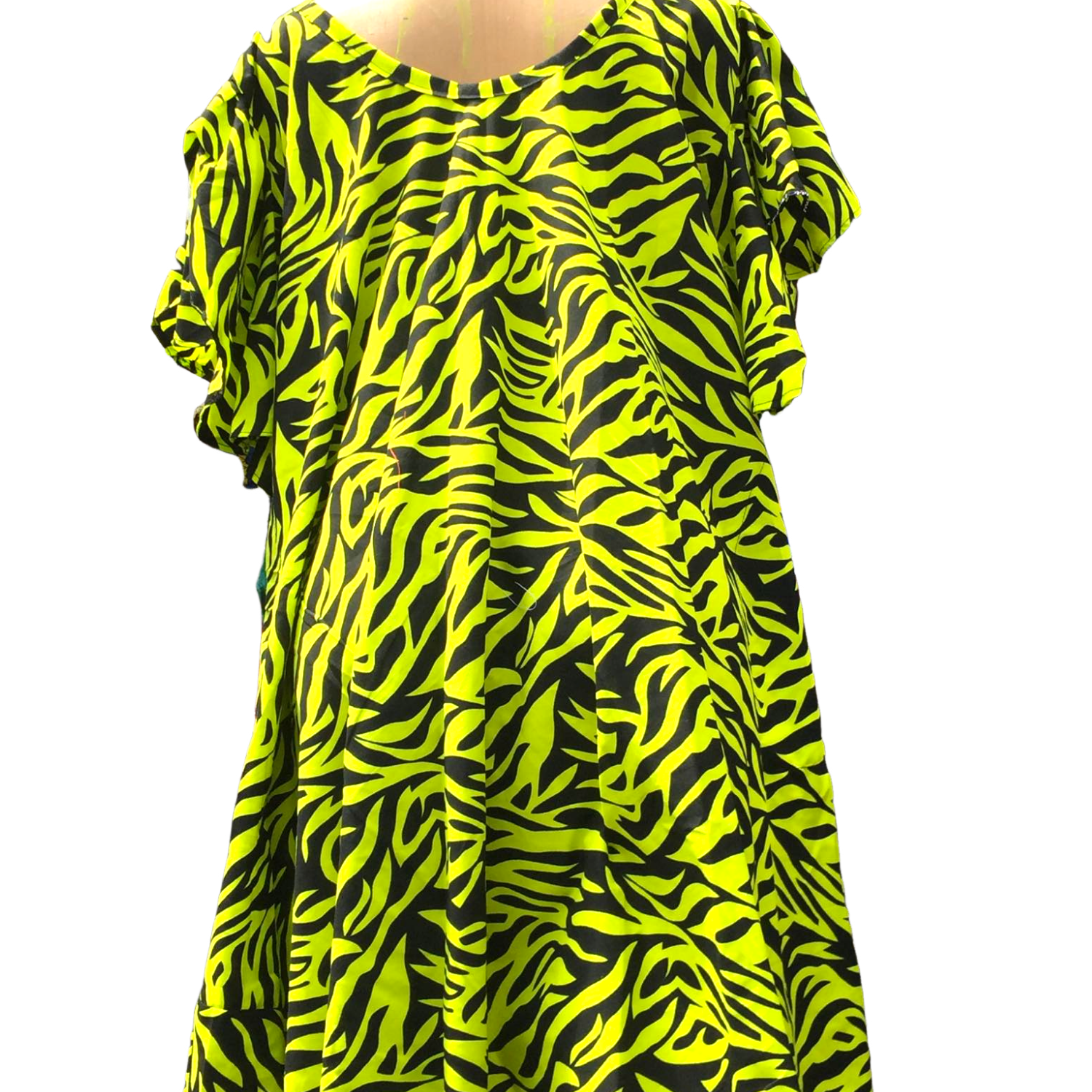 Neon green and black zebra pattern dress on a mannequin against a white background
