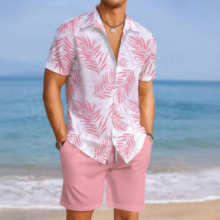 Person wearing a pink and white patterned shirt and pink shorts on a beach.