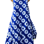 Blue dress with white geometric pattern on a mannequin against a white background