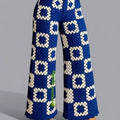 Blue patterned pants on a gray background