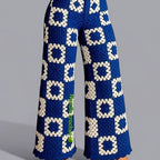 Blue patterned pants on a gray background
