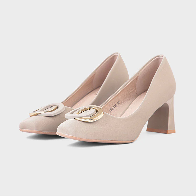 Pair of beige high-heeled shoes with gold accents on a light gray background