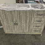 Wooden cabinet with sink and drawers on a concrete floor