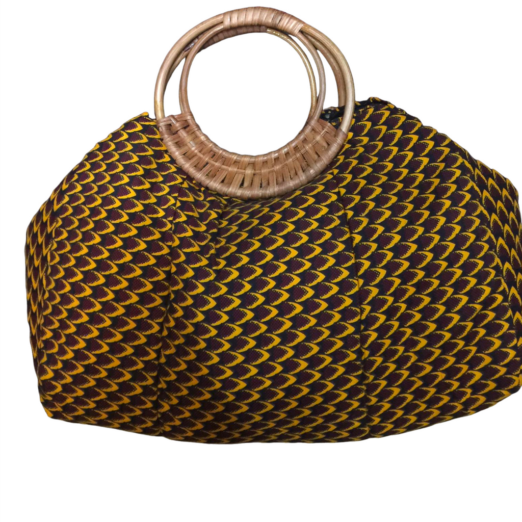 Yellow and black woven handbag with wooden handle on a white background