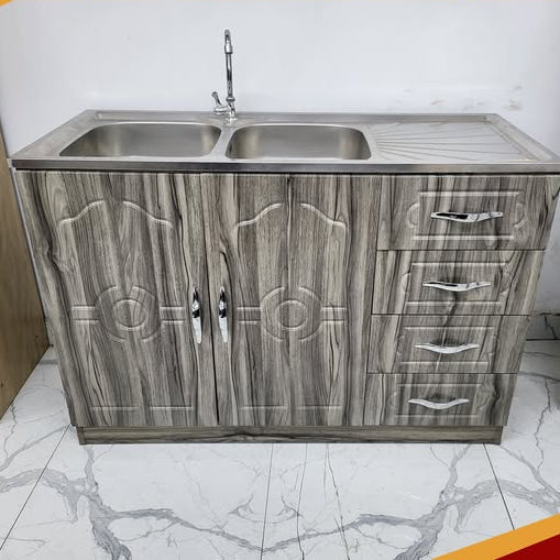 Kitchen cabinet with sink on a marble floor, with text overlay at the top and bottom.