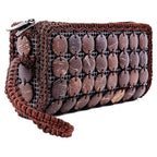 Brown clutch bag with textured surface and decorative elements on a white background