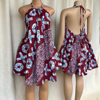 Red and white patterned dress on a mannequin against a plain background