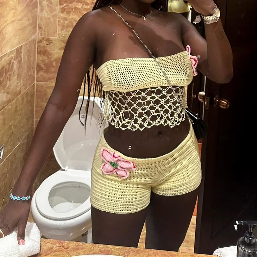 Woman taking a mirror selfie in a bathroom with tiled walls.