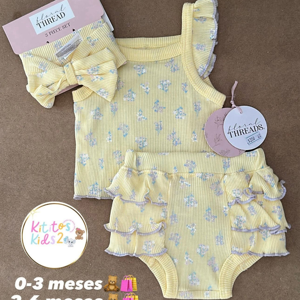 Baby outfit set with ruffled top and bloomers on a brown background, featuring 'Kitty Kids' branding.