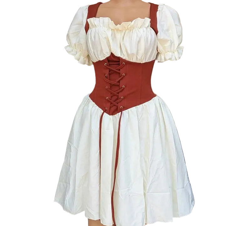 Mannequin wearing a white dress with red corset on a plain background