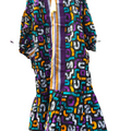 Colorful patterned dress with a white background