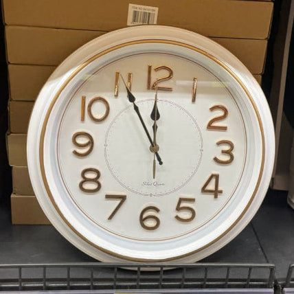 Round wall clock on a store shelf with price tag