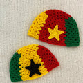 Two crocheted hats with Ghanaian flag colors and a star on a light gray background