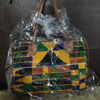 Colorful patterned bag wrapped in plastic with a colorful background