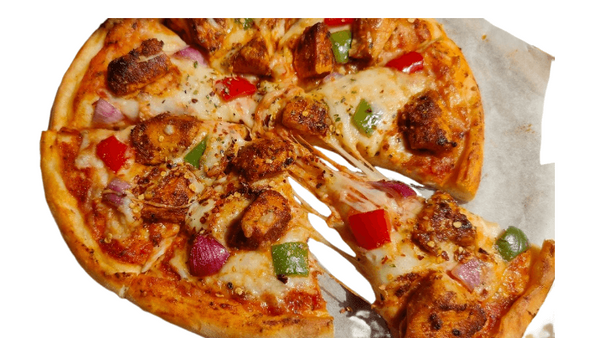Partial view of a pizza with various toppings on a white background. Chicken pizza from Town Bakery 2