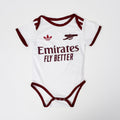 Baby onesie with Emirates branding on a white background