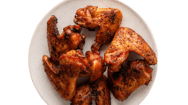 Platter of fried chicken on a white background. Fried chicken wings from Town Bakery
