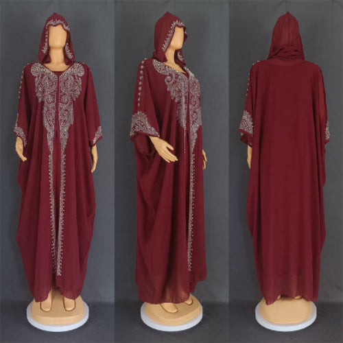 Maroon abaya with silver embroidery on a gray background