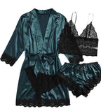 Teal satin robe with black lace trim and matching bra and panties set on a white background