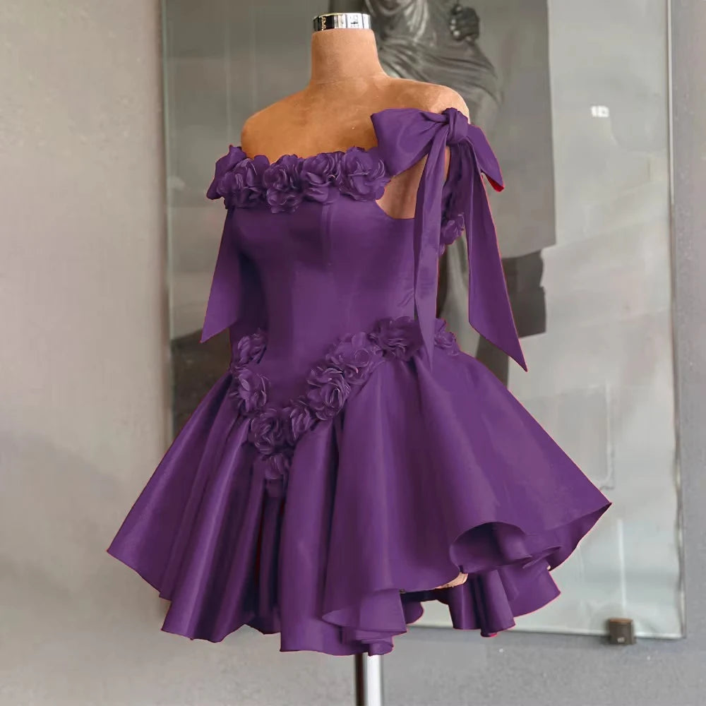Purple off-shoulder dress with floral details on a mannequin against a neutral background