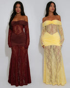 Two women wearing lace dresses, one brown and one yellow, on a white background.