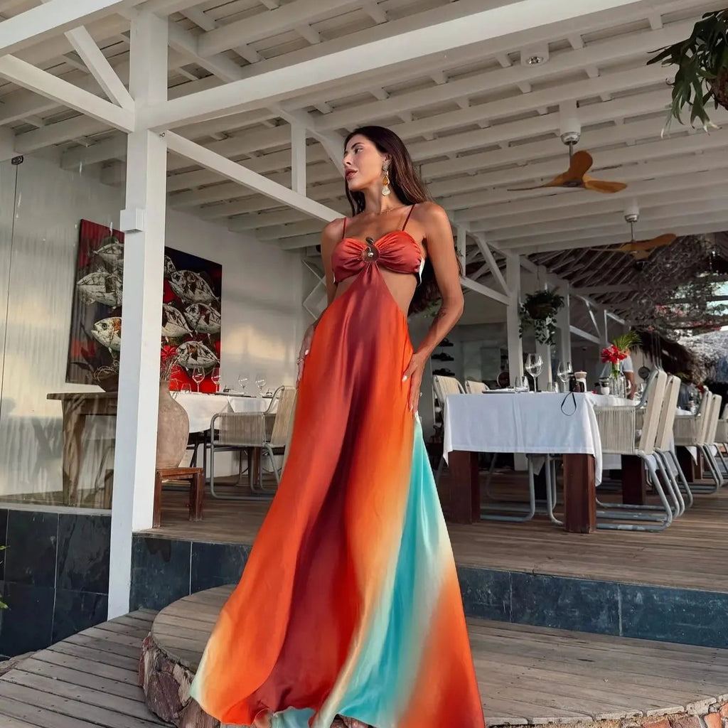 Woman in a colorful dress standing in a restaurant setting