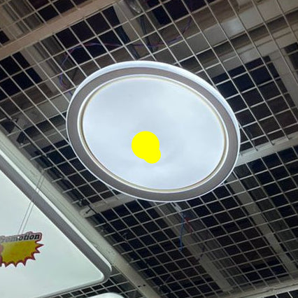 Ceiling with various light fixtures and a grid pattern