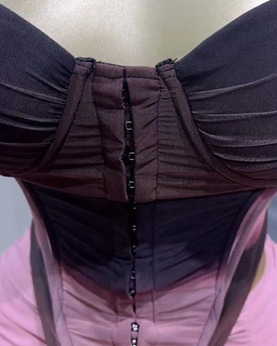 Close-up of a person wearing a dark brown jacket with a pink interior.