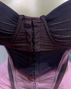 Close-up of a person wearing a dark brown jacket with a pink interior.