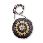 Round bag with decorative elements on a white background