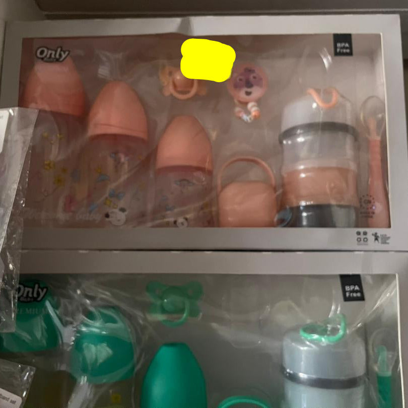 Baby bottle and pacifier set with 'Only' branding on a shelf.