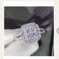 Silver ring with gemstones displayed on a screen, likely from an online shopping app.