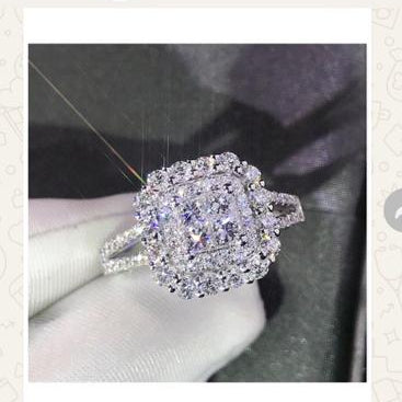 Silver ring with gemstones displayed on a screen, likely from an online shopping app.
