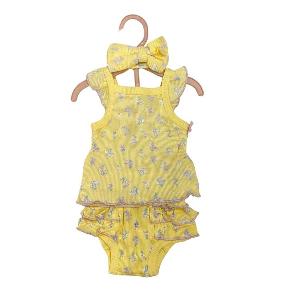 Yellow baby dress with ruffles and a matching headband on a hanger against a white background