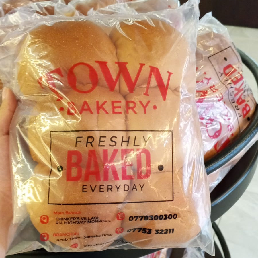 Packaged bread with 'Town Bakery' branding on a tray.