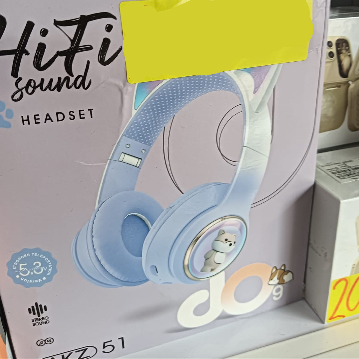 Headset packaging with a price tag of $12.00 USD on a store shelf.