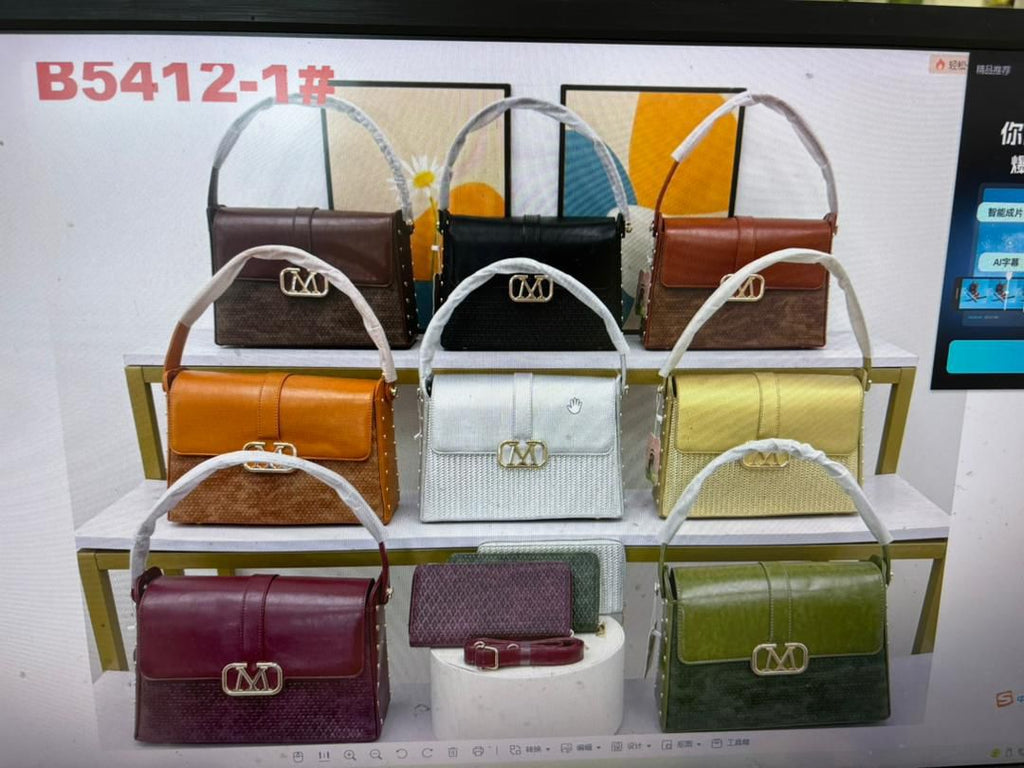 Display of various handbags in different colors on a shelf.