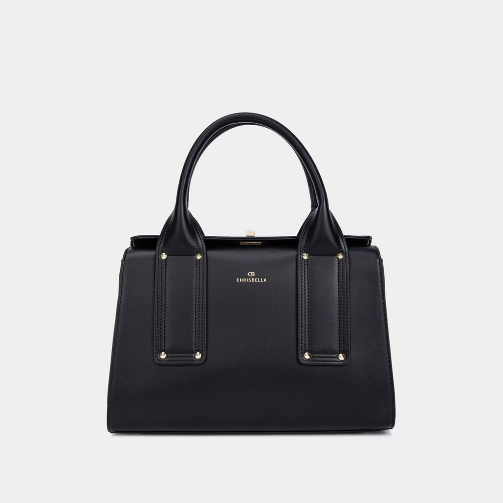 Black handbag with gold accents on a light gray background