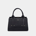 Black handbag with gold accents on a light gray background