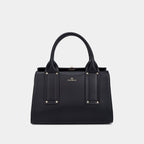 Black handbag with gold accents on a light gray background