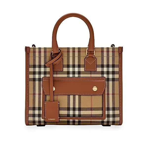 Designer handbag with checkered pattern and brown leather accents on a white background