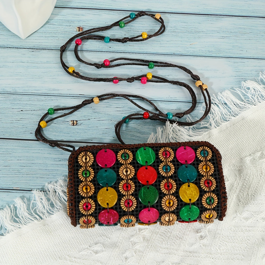 Colorful handbag with patterned design on a light blue wooden surface