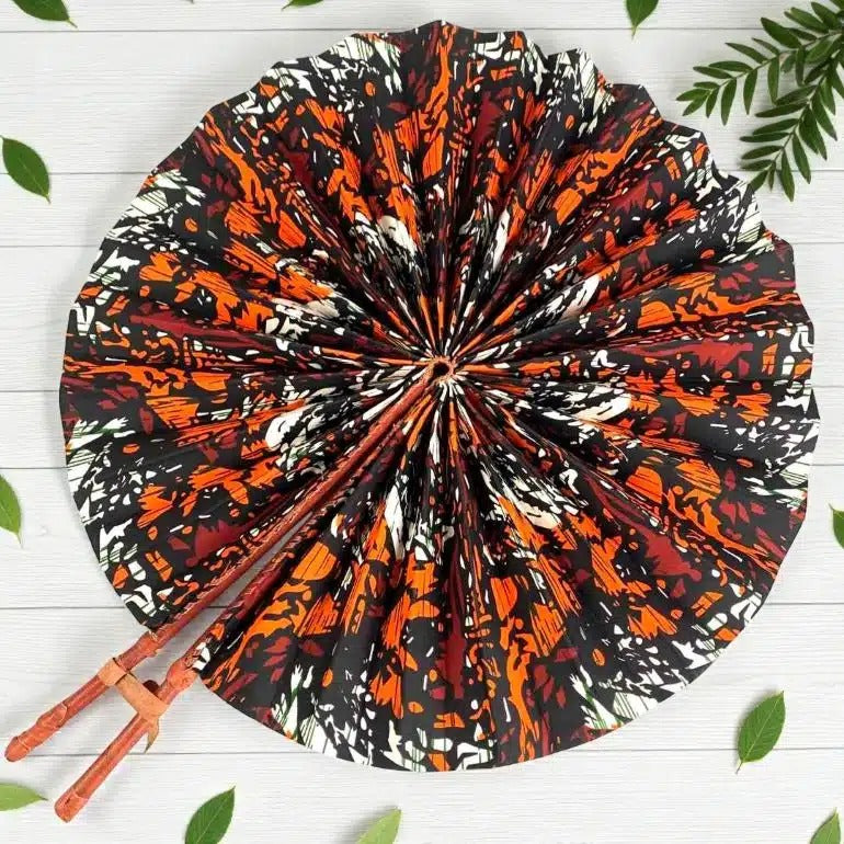 Decorative plate with a colorful abstract pattern and wooden chopsticks on a white surface.
