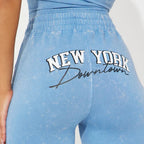 Blue leggings with 'New York Downtown' text on a white background