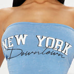 Blue strapless top with 'New York Downtown' text worn by a person