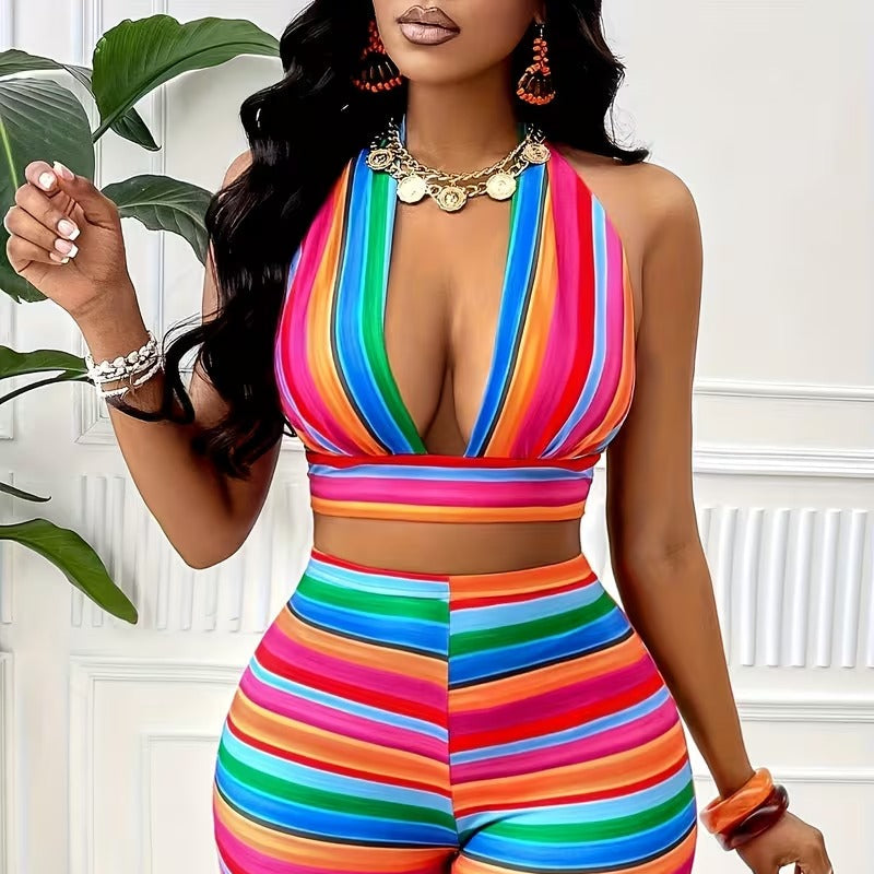 Woman wearing a colorful striped outfit with a white background