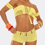 Yellow crochet bikini set on a plain background