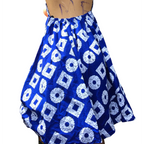 Blue and white patterned dress on a mannequin with a white background